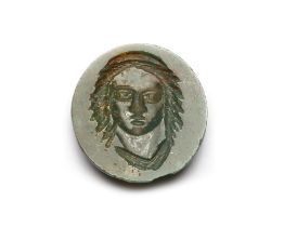 A ROMAN GREEN JASPER INTAGLIO, HEAD OF A MAN, CIRCA 3RD-4TH CENTURY A.D.