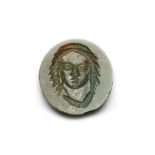 A ROMAN GREEN JASPER INTAGLIO, HEAD OF A MAN, CIRCA 3RD-4TH CENTURY A.D.