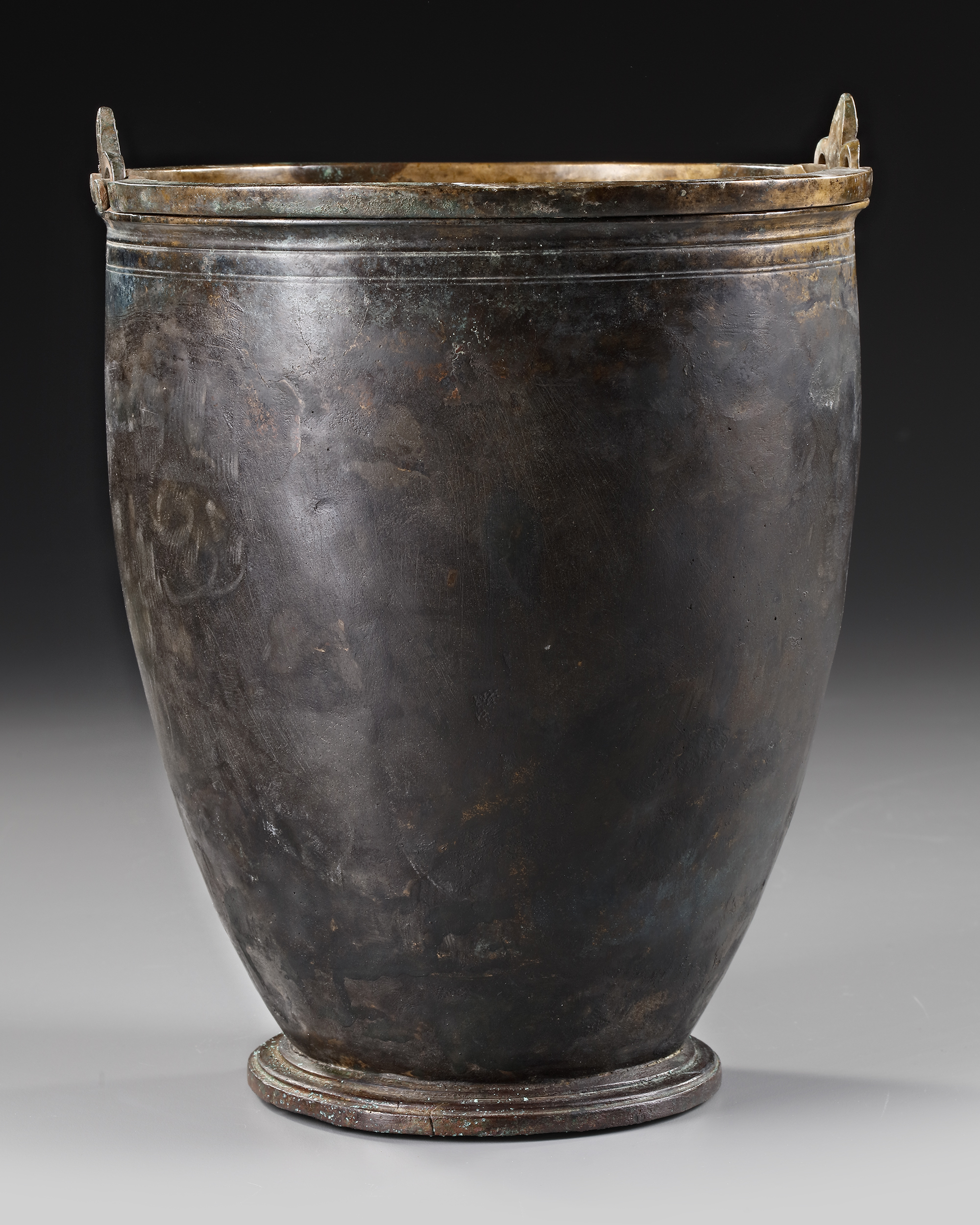 A GREEK BRONZE SITULA, CIRCA 4TH CENTURY B.C.