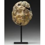 A GRECO-ROMAN GILT BRONZE MASK, CIRCA 1ST CENTURY B.C. / A.D.