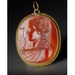 A ROMAN CARNELIAN INTAGLIO WITH THE BUST OF APOLLO, CIRCA 1ST CENTURY B.C. / A.D.