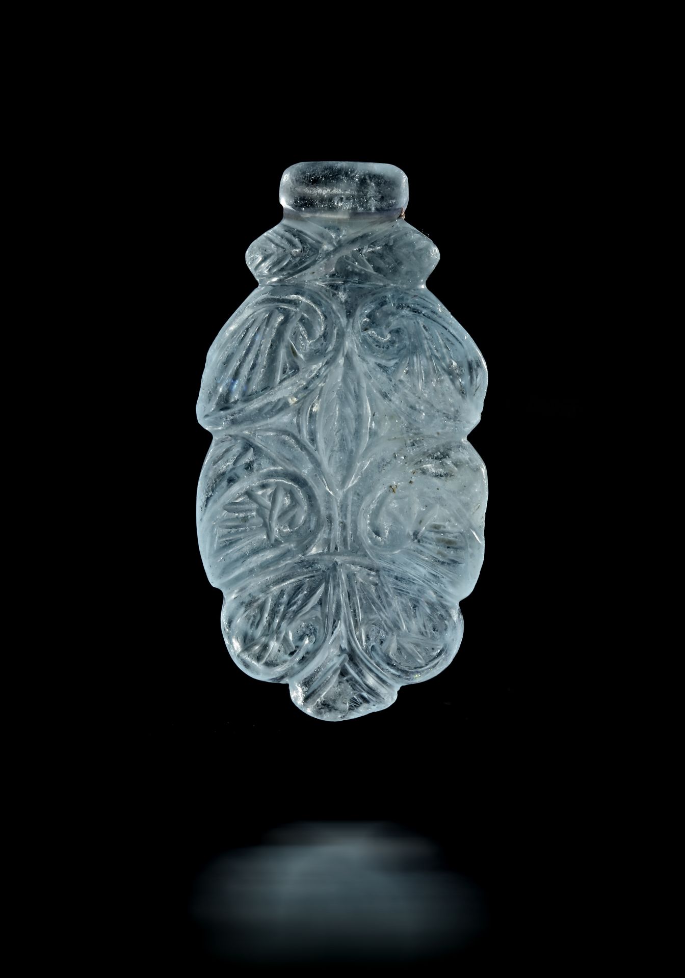 A FATIMID CRYSTAL CARVED PENDANT, EGYPT, 12TH CENTURY