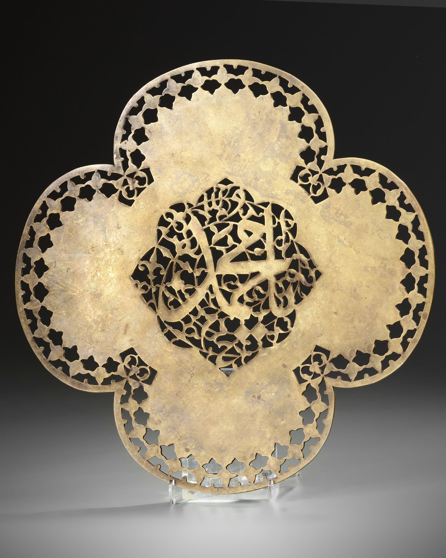 AN ELEGANT SAFAVID PIERCED STEEL QUATREFOIL PANEL, PERSIA, 17TH CENTURY