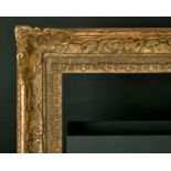 20th Century English School. A Gilt Composition Frame, with swept centres and corners, rebate 21"