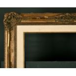 20th Century English School. A Gilt Composition Frame, with swept and pierced centres and corners,