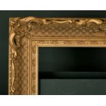 20th Century English School. A Gilt Composition Frame, with swept and pierced centres and corners,