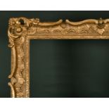 20th Century English School. A Gilt Composition Frame, with swept and pierced centres and corners,