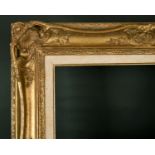 20th Century European School. A Gilt Composition Frame, with swept and pierced centres and