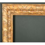 Alexander G Ley & Son. A Carved Giltwood Bolognese Leaf Frame, rebate 36" x 28.5" (91.5 x 72.4cm)