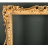 18th Century English School. A Carved Giltwood Frame, with swept and pierced centres and corners,