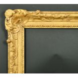 18th Century English School. A Carved Giltwood Frame, with swept corners, circa 1740, rebate 30" x