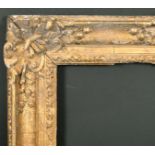 18th Century French School. A Carved Giltwood Louis XV Frame, with swept centres and corners,