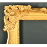 19th Century French School. A Carved Giltwood Frame, with swept and pierced centres and corners,