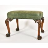 Alexander G Ley & Son. A Reproduction George II Style Carved Wood Stool with Green Suede Upholstery,