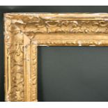 Early 18th Century French School. A Louis XIV Carved Giltwood Frame, with swept centres and corners,