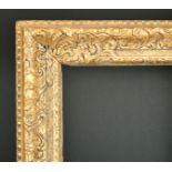 Early 18th Century English School. A Running Pattern Carved Giltwood Frame, circa 1725, rebate 34" x