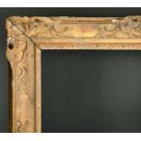 Late 17th Century French School. A Louis XIV Carved Giltwood Frame, with swept and pierced centres