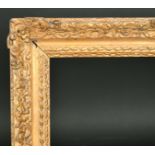 Early 18th Century English School. A Carved Giltwood Frame, with swept centres and corners, circa