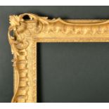 Alexander G Ley & Son. A Reproduction Carved Giltwood Frame, with swept and pierced centres and
