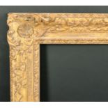 Alexander G Ley & Son. A Reproduction Carved Giltwood Frame, with swept centres and corners,