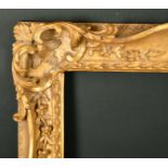 Alexander G Ley & Son. A Reproduction Carved Giltwood Frame, with swept and pierced centres and