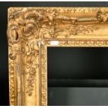 19th Century English School. A Gilt Composition Frame with swept centres and corners, rebate 20" x