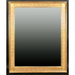 Alexander G Ley & Son. A Reproduction Neoclassical Fluted Mirror, Overall 52.75" x 42.5" (134 x