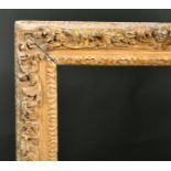 19th Century English School. A Carved Giltwood Frame, with swept centres and corners, rebate 29.