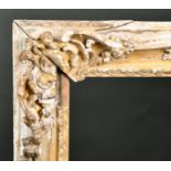18th Century French School. A Carved Giltwood Louis XV Frame with swept centres and corners,