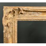 19th Century French School. A Carved Giltwood Frame with swept and pierced centres and corners,