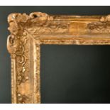 18th Century French School. A Carved Giltwood Louis Frame, with swept and pierced centres and