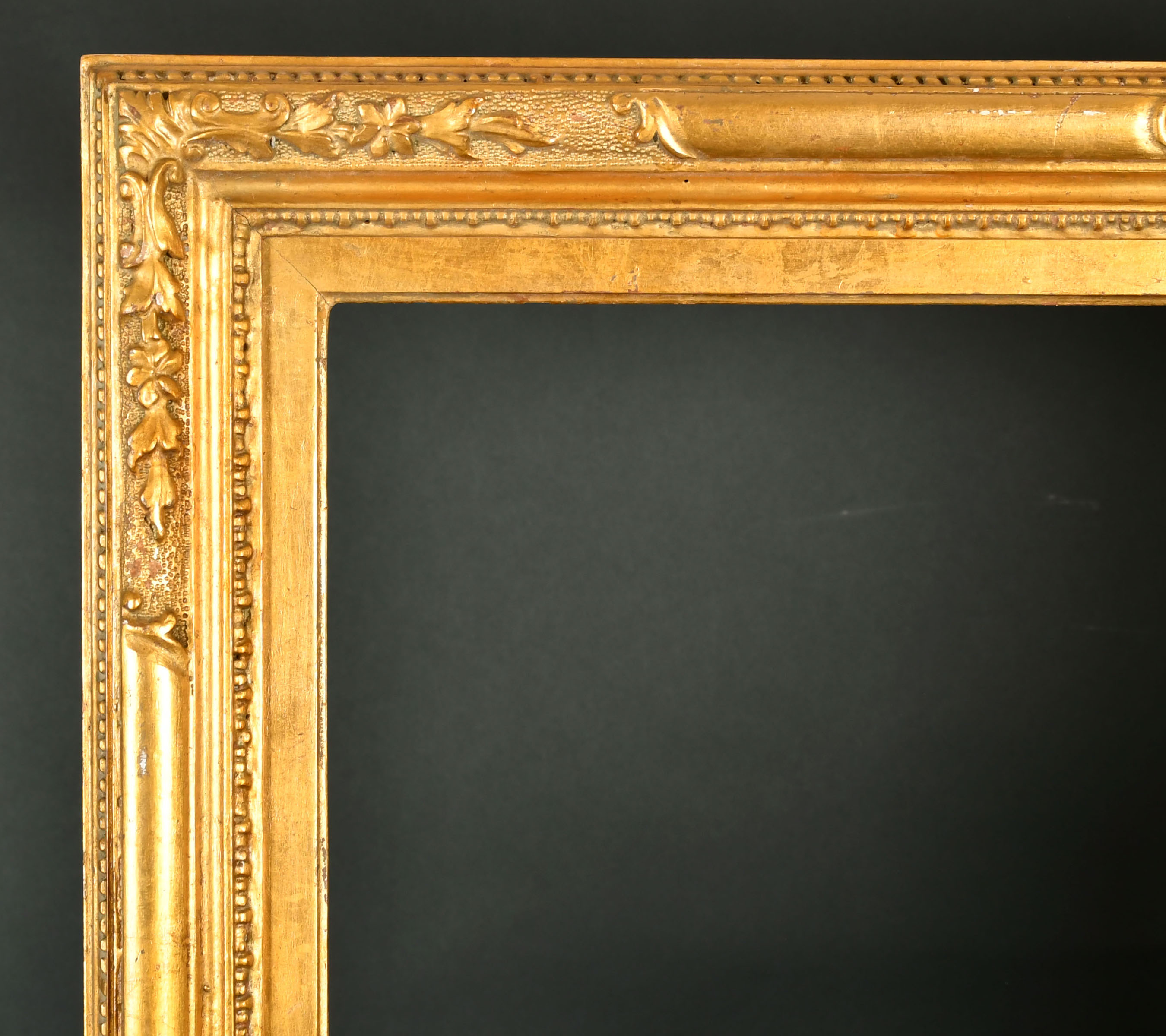 19th Century Italian School. A Carved Giltwood Frame, rebate 34" x 27" (86.3 x 68.7cm)