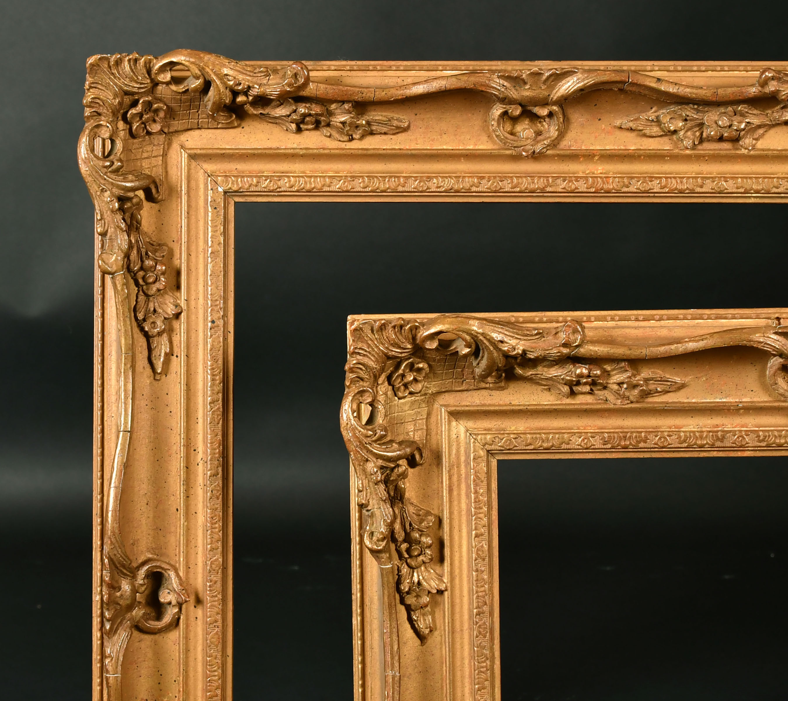 19th Century English School. A Pair of Gilt Composition Frames, with swept and pierced centres and