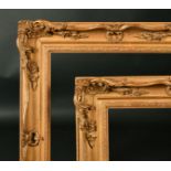 19th Century English School. A Pair of Gilt Composition Frames, with swept and pierced centres and