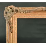 20th Century English School. A Gilt Composition Frame, with swept and pierced centres and corners,