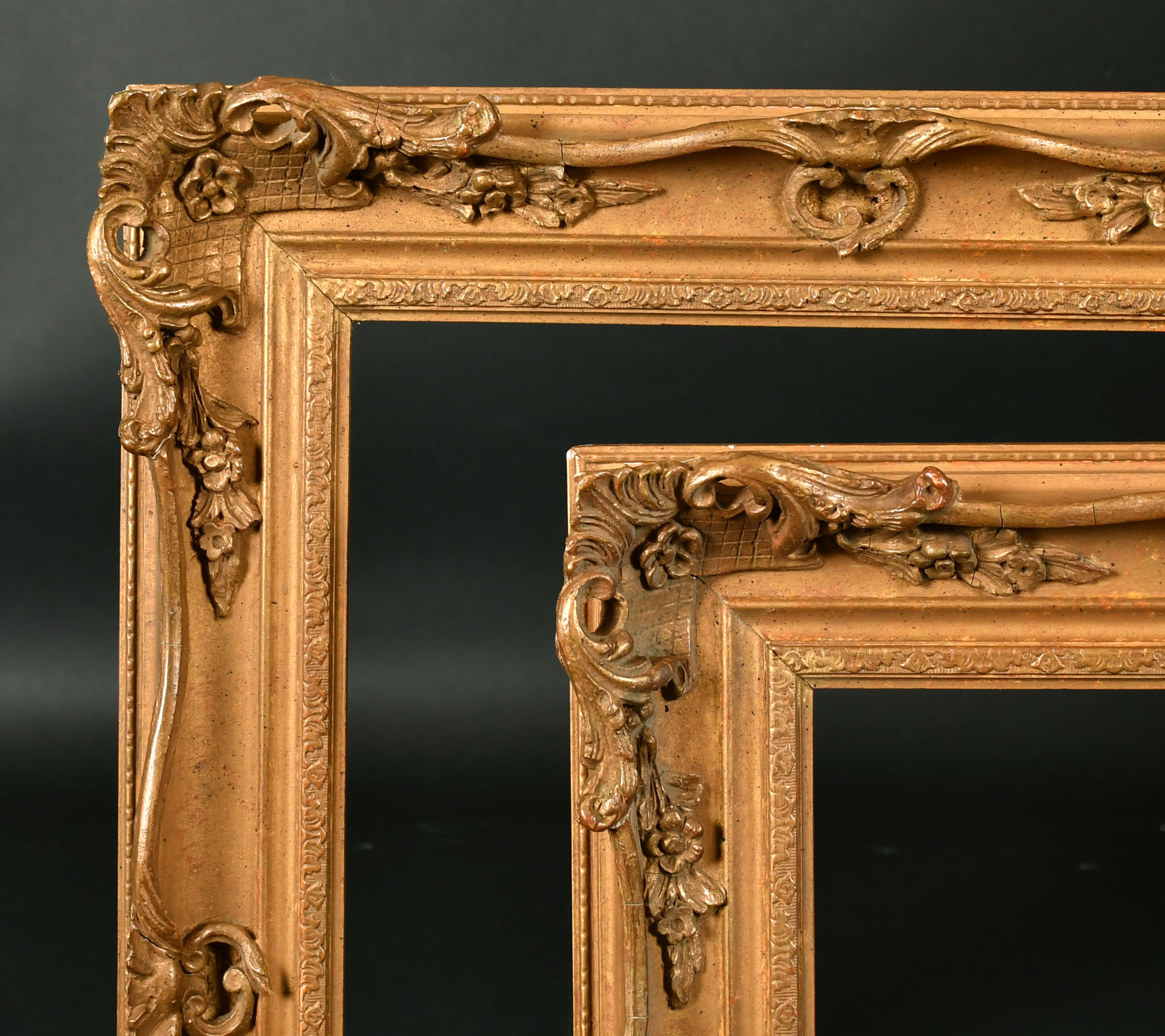 19th Century English School. A Pair of Gilt Composition Frames, with swept and pierced centres and