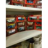 Shelf of matchbox yesteryear advertising van models etc.