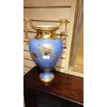 Large impressive Victorian vase with gilded handles slight crack to body stands 46 cms tall .