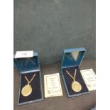 2 Boxed six pences coins pendant s with chain s .