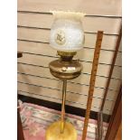 Large antique brass oil lamp with lovely white glass shade .