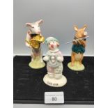 2 piece beswick pig band together with beswick clown figure .