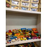 Shelf of playworn vehicles includes dinky and match box .