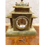 Antique Victorian onyx slate mantle clock with key and pendulum.