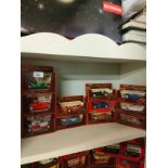 Shelf of matchbox yesteryear classic car models .