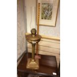 Huge Solid Brass Corinthian column oil lamp on heavy brass squared base stands 28 inches in height .