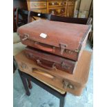 3 Vintage suit cases.