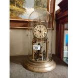 1900s Brass dome clock with glass dome .