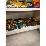 Shelf of playworn vehicles includes dinky and match box .