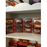 Shelf of matchbox yesteryear advertising van models .