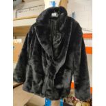 Fur coat size 16 .